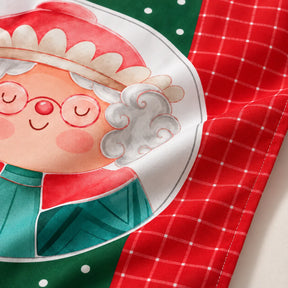 Detalhe da estampa da Mamãe Noel com padrão xadrez vermelho